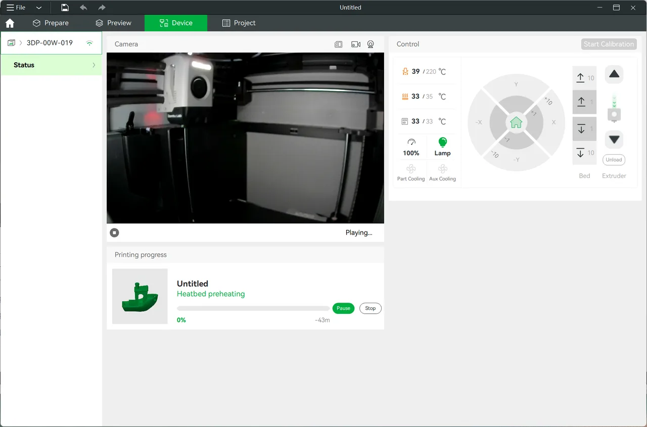 The Device tab streaming the printer's internal camera, with nozzle, bed and chamber temperatures, fan and lamp toggles, axis jog controls, and a print progress panel showing heatbed preheating at 0 percent.