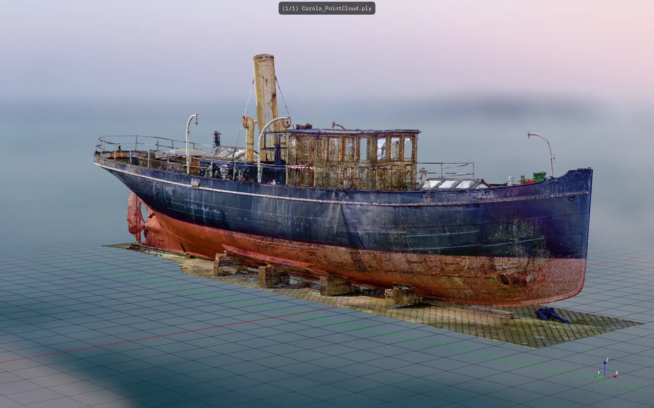 A photogrammetry point cloud of a beached ship loaded from a PLY file, showing how the viewer handles scan data rather than clean geometry.