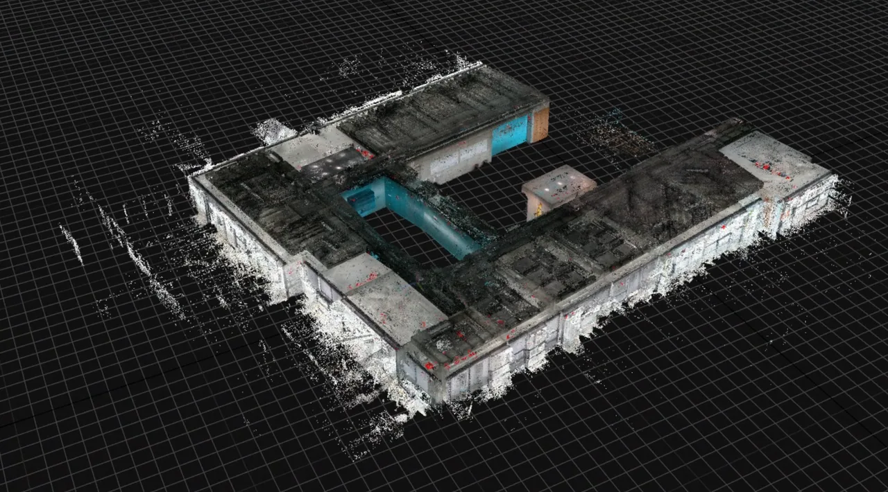 The coloured point cloud of a scanned building in the viewport, reconstructed from SLAM capture data before meshing.