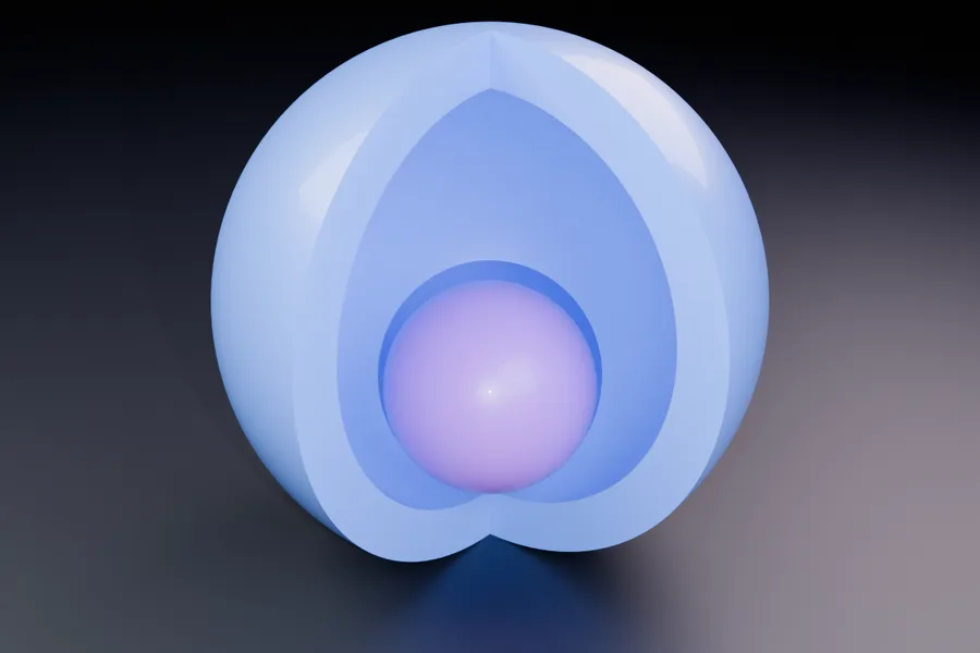 A hollow sphere cut open to show the cavity wall and a loose ball inside it